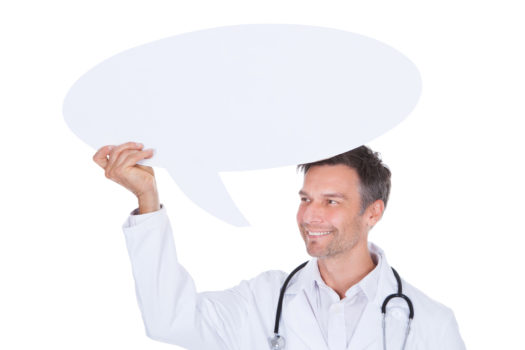 Portrait Of Happy Mature Male Doctor Holding Thought Bubble